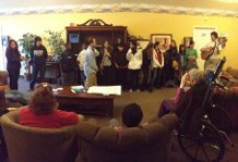 Junior Youth singing to residents at a nearby senior center.